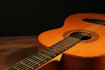 Fototapeta na wymiar Acoustic guitar on dark background