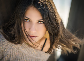 Naklejka premium Portrait of a beautiful brunette. Close-up. Color toned.