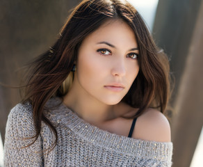 Fototapeta premium Portrait of a beautiful brunette. Close-up. Color toned.
