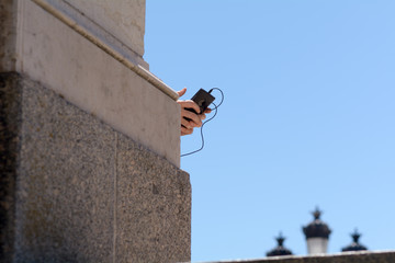 Playing with mobile phone at the Monument aux Girondins Bordeaux