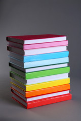 Colorful books on gray background