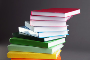 Colorful books on gray background