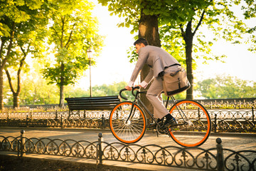 Businessman riding bicycle