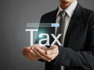 businessman tax in  hand