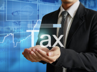 businessman tax in  hand