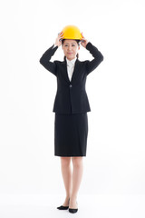 ヘルメットを被っているスーツの日本人女性,全身