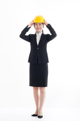 ヘルメットを被っているスーツの日本人女性,全身