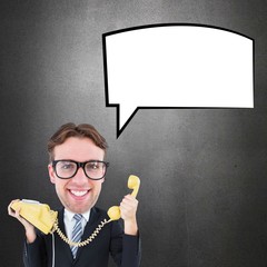 Composite image of geeky businessman holding phone