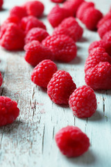 Fresh raspberries on wooden background