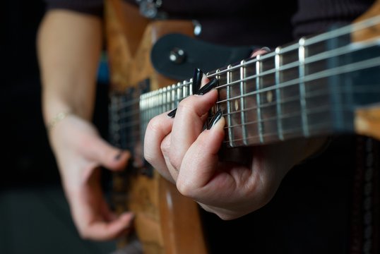 Playing on guitar