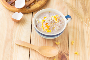 Traditional chinese brown rice gruel in white bowl, congee