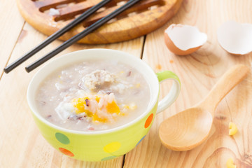 Traditional chinese brown rice gruel in white bowl, congee