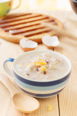 Traditional chinese brown rice gruel in white bowl, congee