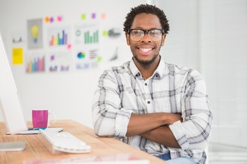Fototapeta premium Young businessman smiling at the camera 