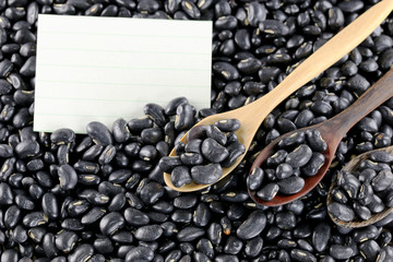 pile black beans and note paper.