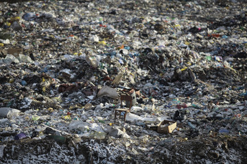 Chair on garbage dump