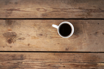 Obraz na płótnie Canvas Cup of coffee on wooden background