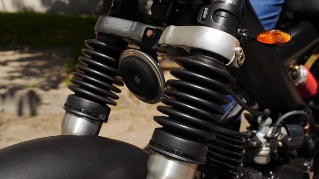 Suspension check in motorbike.