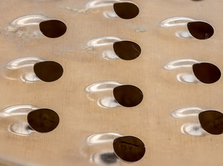 Macro image of sections of a cheese grater