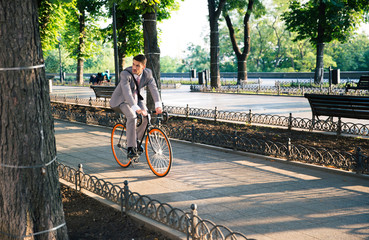 Businessman riding bicycle