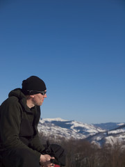 The man resting in the mountains.