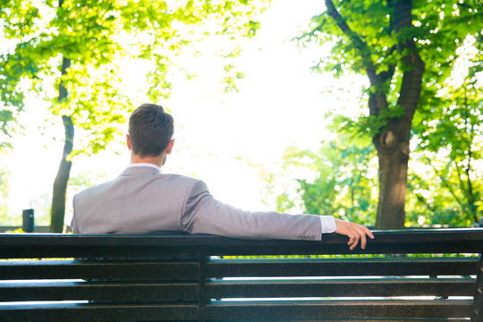 Businessman Sitting On The Bench Outdoors