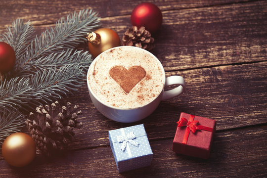 Cup of coffee and christmas gifts