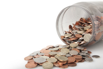 Money Jar full of bank of england coins,pound coins on top