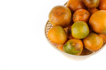 orange fruit in basket, isolated on white background