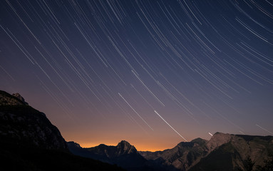Startrails over the Apuan Alps at sunset, Tuscany, Italy