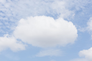 The big white fluffy cloud over the blue sky.