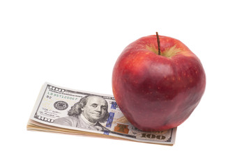 apple and dollars isolated on a white background