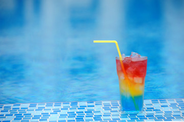 Cocktail at the edge of the swimming pool