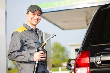 Smiling gas station worker