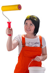 Young woman intending to start painting a wall, isolated on white