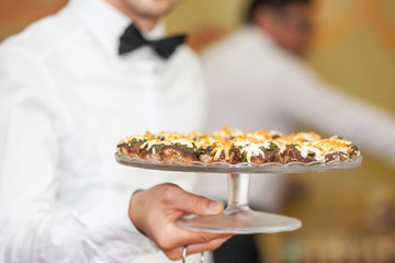 Waiter with stuffed mushrooms