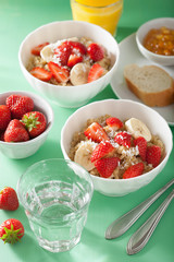 healthy breakfast quinoa with strawberry banana coconut flakes