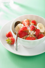 healthy breakfast quinoa with strawberry banana coconut flakes
