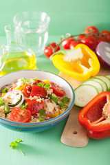 healthy couscous salad with tomato pepper zucchini onion