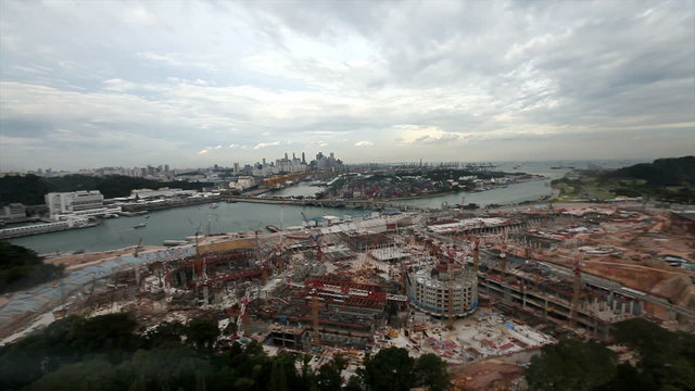 Panoramic view from Tiger Sky Tower. Great construction site in the foreground, monorail, Keppel Harbour, Terminal and  skyline of Central Business District in the background.