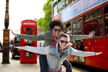 happy teenage couple having fun in london city