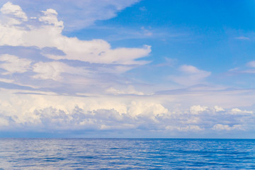 Summer landscape with sea and horizon over water