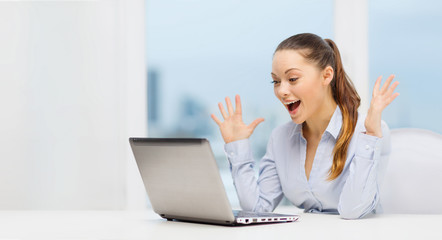 surprised businesswoman with laptop