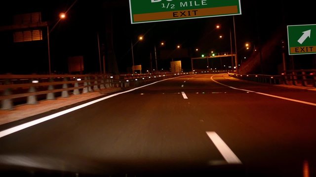 Driving on Highway/interstate at night,  Exit sign of the City Of Boston, Massachusetts