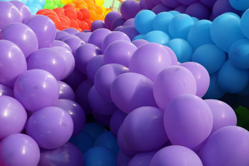 Lot of colorful balloons with violet in front of all