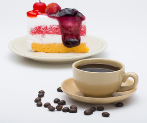 cup of coffee and delicious cake on white background