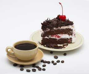cup of coffee and delicious cake on white background