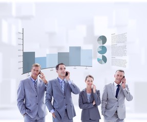 Fototapeta premium Composite image of employees using their mobile phone