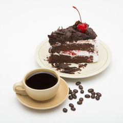 cup of coffee and delicious cake on white background