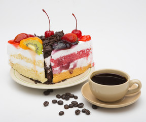 cup of coffee and delicious cake on white background